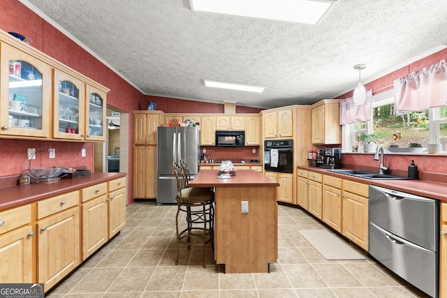 329 Summer Glen Rd, Dahlonega, GA 30533 - kitchen with black appliances, a breakfast bar, light brown cabinetry, a textured ceiling, and light tile patterned floors