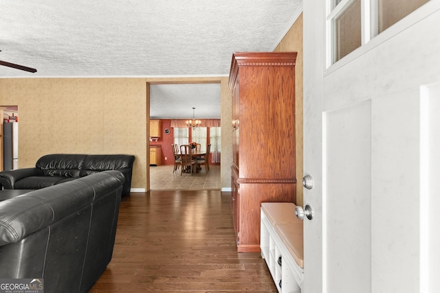 329 Summer Glen Rd, Dahlonega, GA 30533 - living area with dark wood-style floors, a textured ceiling, a chandelier, a ceiling fan, and ornamental molding