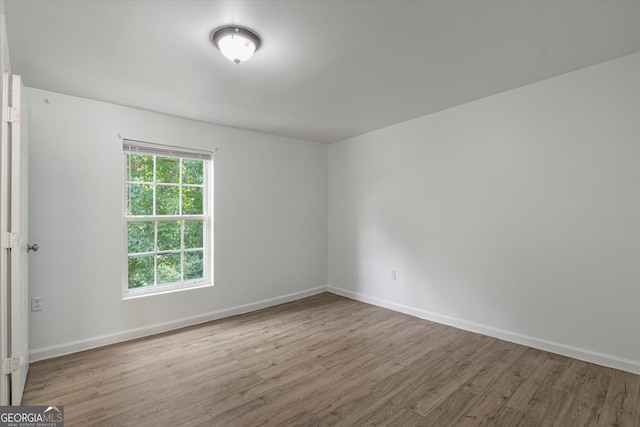 5861 Community Rd SE, Mableton, GA 30126 - unfurnished room with wood finished floors and baseboards