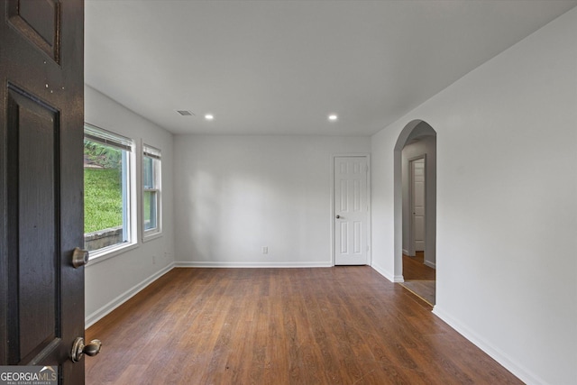 5861 Community Rd SE, Mableton, GA 30126 - unfurnished room featuring recessed lighting, arched walkways, and wood finished floors