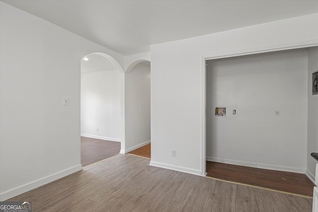5861 Community Rd SE, Mableton, GA 30126 - unfurnished room featuring wood finished floors and arched walkways