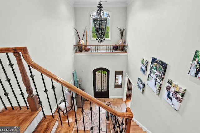 2118 Chatham, Dalton, GA 30720 - entrance foyer featuring wood finished floors, a chandelier, crown molding, a towering ceiling, and stairway