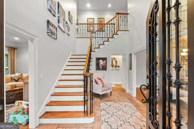 2118 Chatham, Dalton, GA 30720 - entrance foyer with a towering ceiling, ornamental molding, stairs, stone tile floors, and recessed lighting