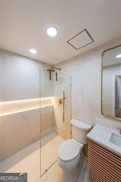 503 Rising Dr, Woodstock, GA 30189 - bathroom featuring walk in shower, vanity, and recessed lighting