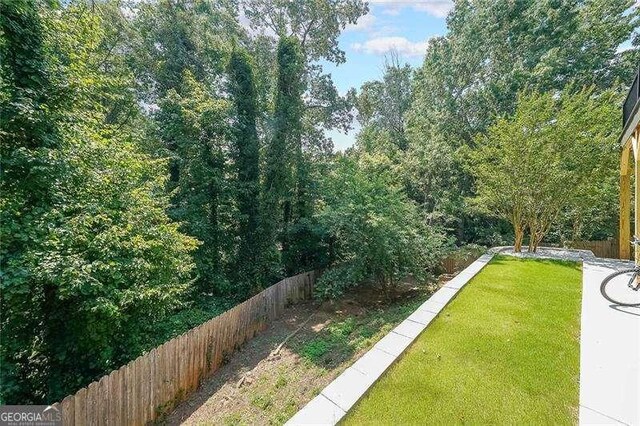 503 Rising Dr, Woodstock, GA 30189 - view of yard featuring a wooded view