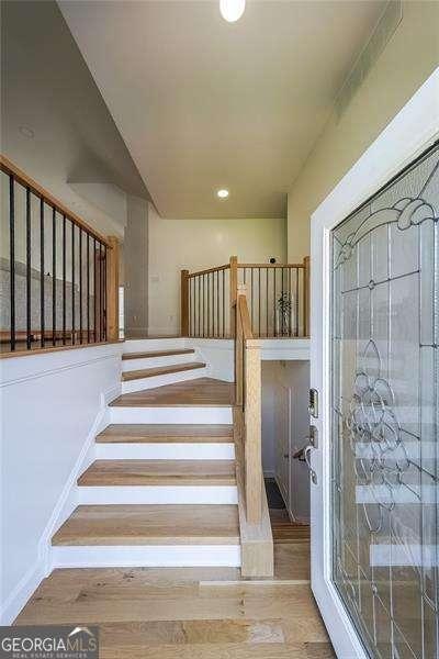 503 Rising Dr, Woodstock, GA 30189 - stairway featuring wood finished floors and recessed lighting