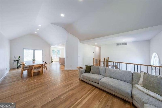 503 Rising Dr, Woodstock, GA 30189 - living room with light wood-type flooring, lofted ceiling, and recessed lighting