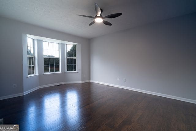 2333 Wilkins Cv, Decatur, GA 30035 - empty room with ceiling fan and dark wood-type flooring