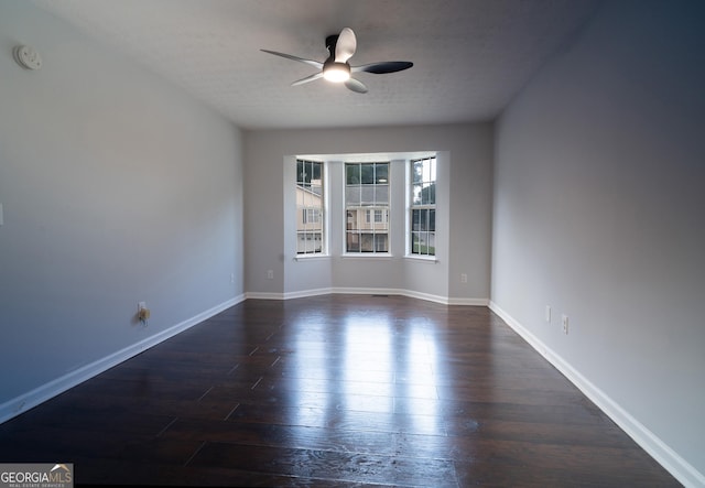 2333 Wilkins Cv, Decatur, GA 30035 - spare room with ceiling fan, a smoke detector, dark wood-style floors, and a textured ceiling