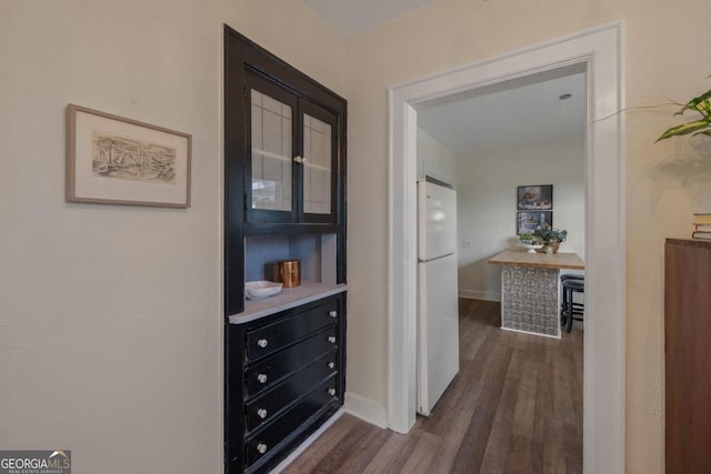 204 S Jefferson Ave, Eatonton, GA 31024 - hall featuring dark wood-style floors and baseboards