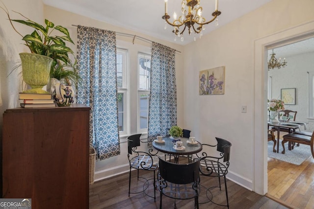 204 S Jefferson Ave, Eatonton, GA 31024 - dining space with a chandelier and wood finished floors