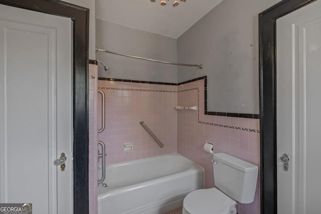 204 S Jefferson Ave, Eatonton, GA 31024 - bathroom with tile walls and bathtub / shower combination