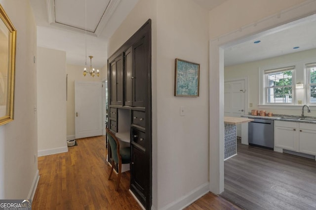 204 S Jefferson Ave, Eatonton, GA 31024 - hall with wood finished floors, attic access, and a chandelier