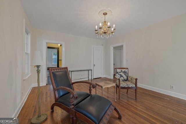 204 S Jefferson Ave, Eatonton, GA 31024 - living area featuring a chandelier and wood finished floors