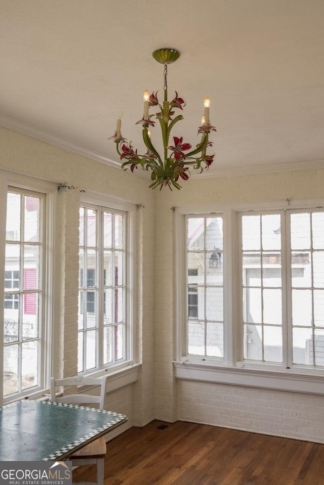 204 S Jefferson Ave, Eatonton, GA 31024 - unfurnished dining area featuring dark wood-style floors, plenty of natural light, and ornamental molding