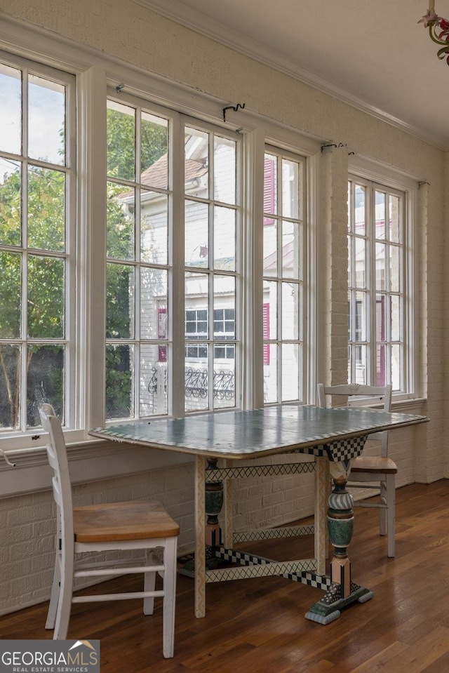 204 S Jefferson Ave, Eatonton, GA 31024 - dining room featuring ornamental molding and wood finished floors