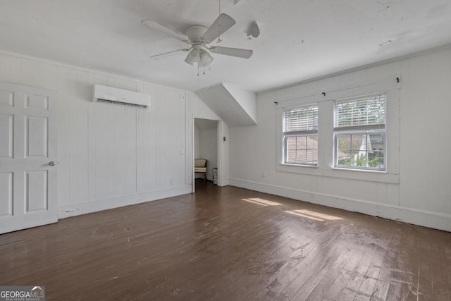 204 S Jefferson Ave, Eatonton, GA 31024 - additional living space featuring a wall unit AC, hardwood / wood-style flooring, and a ceiling fan