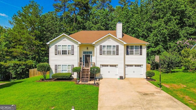 3024 Saddle Creek Dr, Gainesville, GA 30507 - raised ranch with driveway, a garage, a front yard, and a chimney