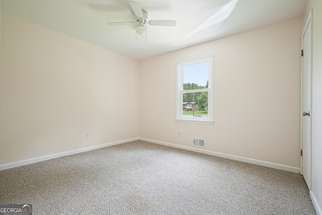 174 Village Dr, Hiram, GA 30141 - empty room with carpet and ceiling fan