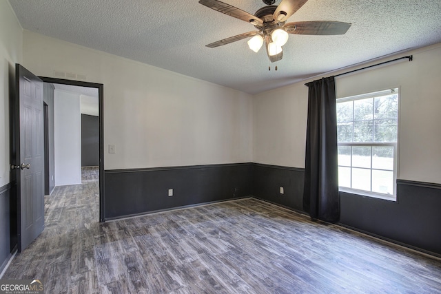 1525 Bailey Rd, Aragon, GA 30104 - unfurnished room featuring wood finished floors, ceiling fan, and a textured ceiling