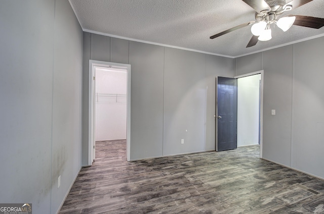 1525 Bailey Rd, Aragon, GA 30104 - spare room with wood finished floors, a textured ceiling, a decorative wall, ornamental molding, and a ceiling fan