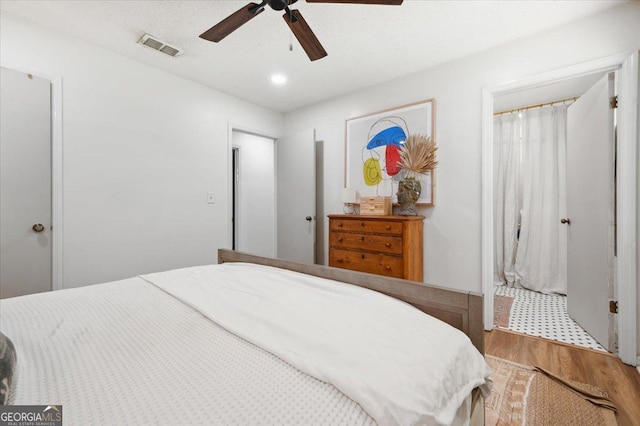 711 Chapman St, Blackshear, GA 31516 - bedroom featuring wood finished floors, a ceiling fan, ensuite bath, and recessed lighting