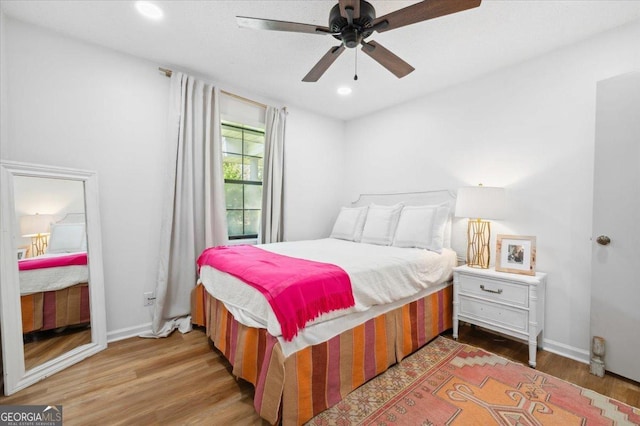 711 Chapman St, Blackshear, GA 31516 - bedroom with wood finished floors, a ceiling fan, and recessed lighting