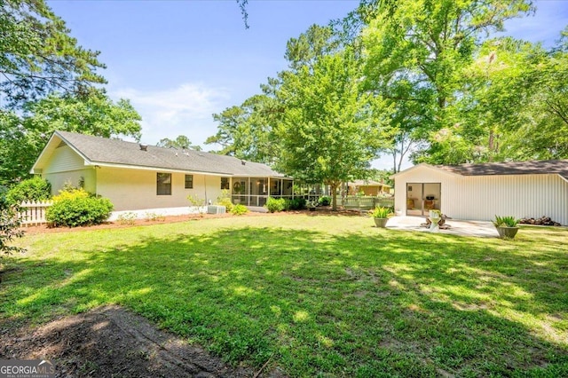711 Chapman St, Blackshear, GA 31516 - view of yard with a patio and a sunroom