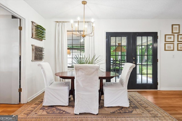 711 Chapman St, Blackshear, GA 31516 - dining space with french doors, a chandelier, and wood finished floors
