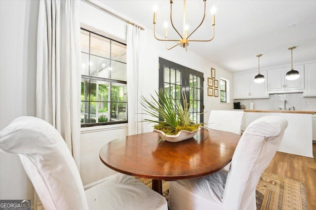 711 Chapman St, Blackshear, GA 31516 - dining space with a chandelier and light wood-type flooring
