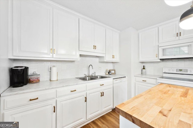 711 Chapman St, Blackshear, GA 31516 - kitchen featuring white appliances, butcher block countertops, white cabinetry, backsplash, and light wood finished floors