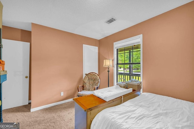 198 Bedford Dr, Hull, GA 30646 - carpeted bedroom with a textured ceiling and baseboards