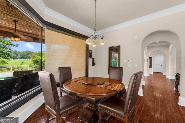 932 Shadowford Fls, Lithonia, GA 30058 - dining space with wood-type flooring, ornamental molding, arched walkways, and a chandelier