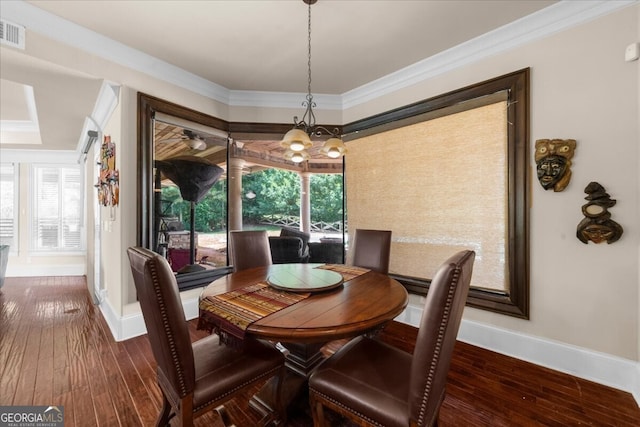 932 Shadowford Fls, Lithonia, GA 30058 - dining space featuring hardwood / wood-style flooring and crown molding