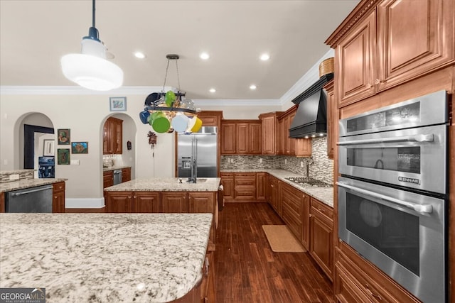 932 Shadowford Fls, Lithonia, GA 30058 - kitchen with appliances with stainless steel finishes, arched walkways, ornamental molding, decorative backsplash, and dark wood finished floors