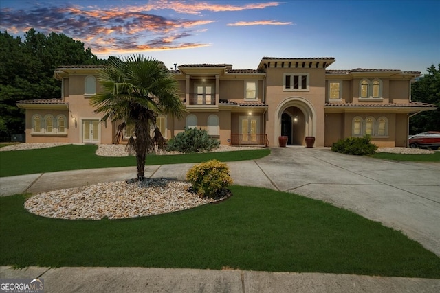 932 Shadowford Fls, Lithonia, GA 30058 - mediterranean / spanish home with french doors, curved driveway, and stucco siding