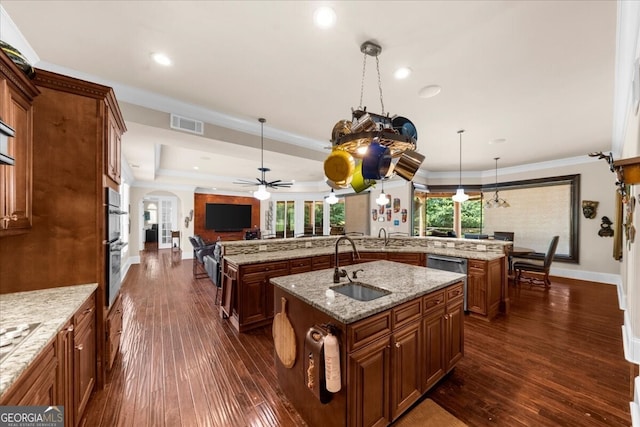 932 Shadowford Fls, Lithonia, GA 30058 - kitchen with a large island, arched walkways, open floor plan, dark wood finished floors, and a ceiling fan