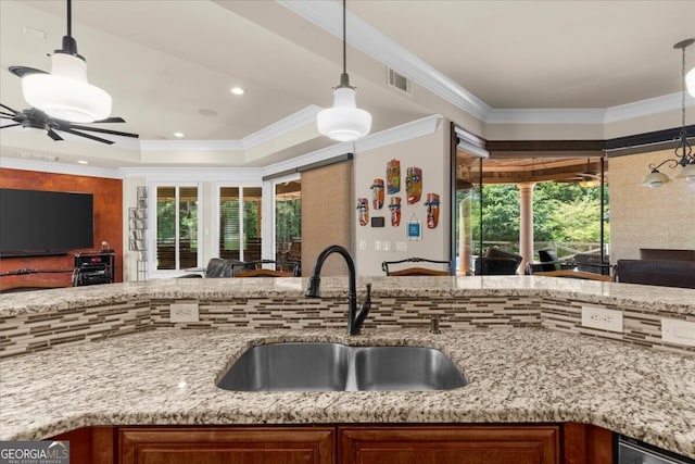 932 Shadowford Fls, Lithonia, GA 30058 - kitchen with open floor plan, light stone counters, plenty of natural light, crown molding, and recessed lighting