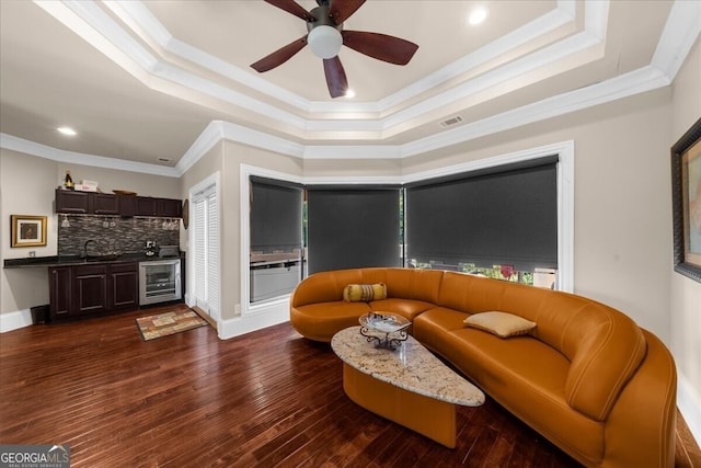 932 Shadowford Fls, Lithonia, GA 30058 - living area with wine cooler, a tray ceiling, crown molding, ceiling fan, and recessed lighting