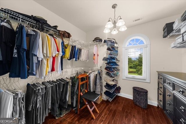 932 Shadowford Fls, Lithonia, GA 30058 - walk in closet featuring wood finished floors and a chandelier