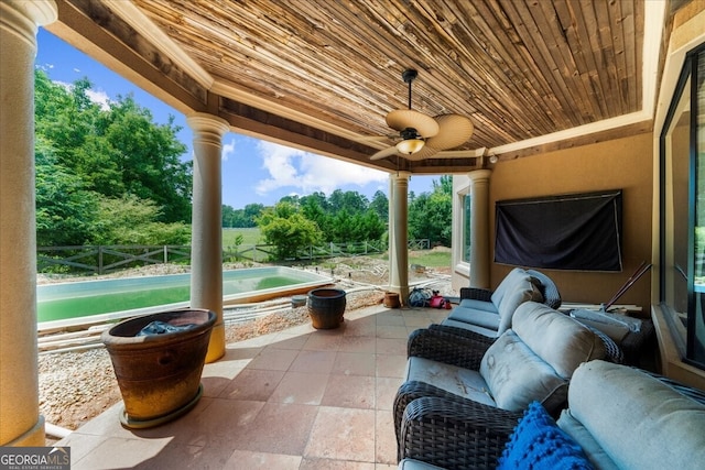 932 Shadowford Fls, Lithonia, GA 30058 - view of patio featuring ceiling fan, an outdoor pool, and view of scattered trees