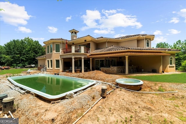 932 Shadowford Fls, Lithonia, GA 30058 - rear view of house with a balcony, a tile roof, stucco siding, and a patio