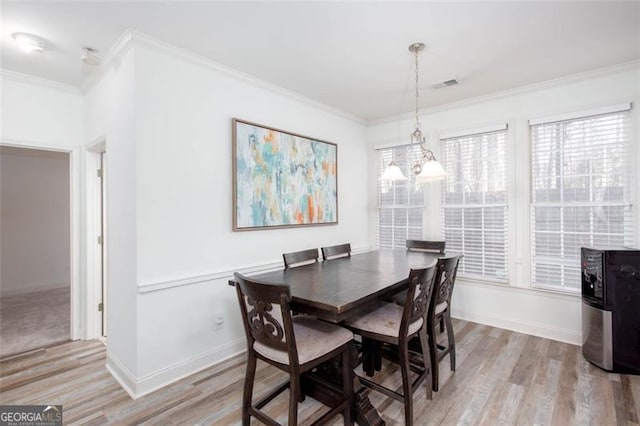 2516 Woolwich Ct, Acworth, GA 30101 - dining room with ornamental molding, light wood-type flooring, and plenty of natural light