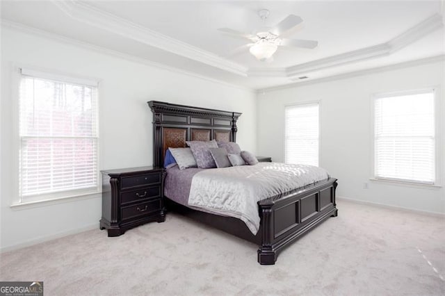2516 Woolwich Ct, Acworth, GA 30101 - bedroom featuring a tray ceiling, crown molding, light carpet, and a ceiling fan