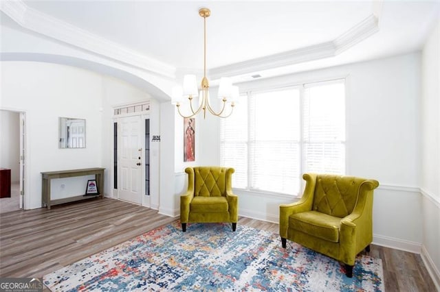 2516 Woolwich Ct, Acworth, GA 30101 - living area with a chandelier, wood finished floors, crown molding, and arched walkways