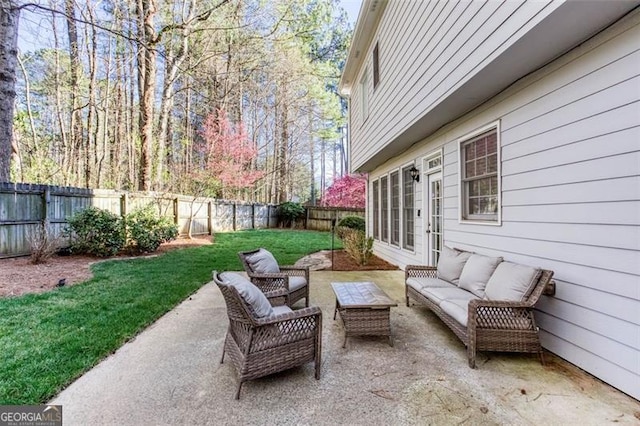 2516 Woolwich Ct, Acworth, GA 30101 - fenced backyard with an outdoor living space and a patio area