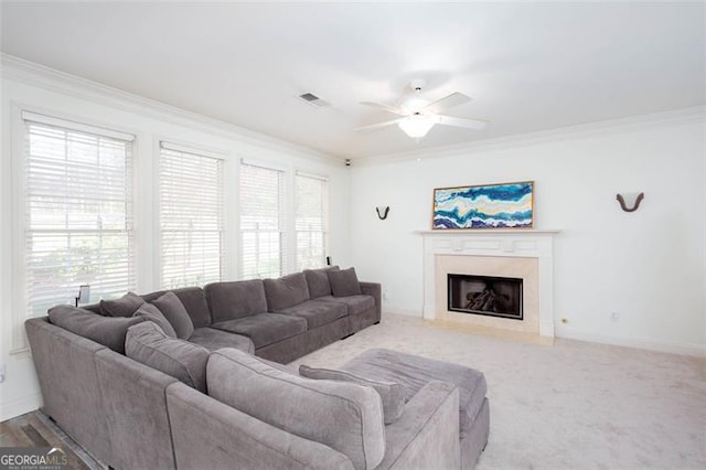 2516 Woolwich Ct, Acworth, GA 30101 - carpeted living room featuring ornamental molding, ceiling fan, and a fireplace with flush hearth