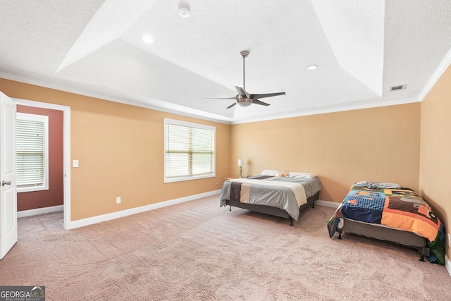 2670 Trotters Pointe Dr, Snellville, GA 30039 - bedroom with crown molding, light colored carpet, a textured ceiling, a raised ceiling, and ceiling fan