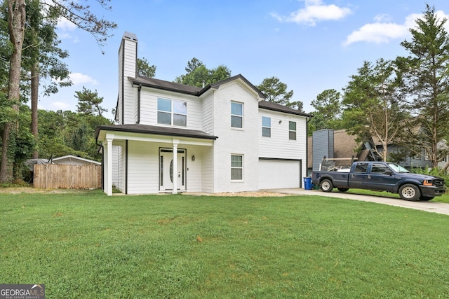2670 Trotters Pointe Dr, Snellville, GA 30039 - view of front of house featuring concrete driveway, a chimney, a garage, and covered porch
