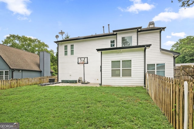 2670 Trotters Pointe Dr, Snellville, GA 30039 - rear view of house with a fenced backyard and a chimney